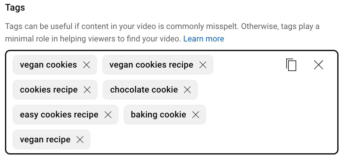 Tag suggestions for a YouTube video related to vegan cookies. Suggested tags include 'vegan cookies,' 'vegan cookies recipe,' 'cookies recipe,' 'chocolate cookie,' and 'vegan recipe